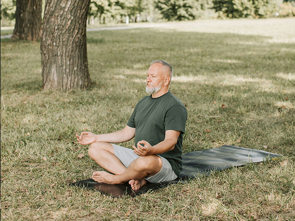 Decorative image of man doing yoga in park for article topic
partial hospitalization program - PHP